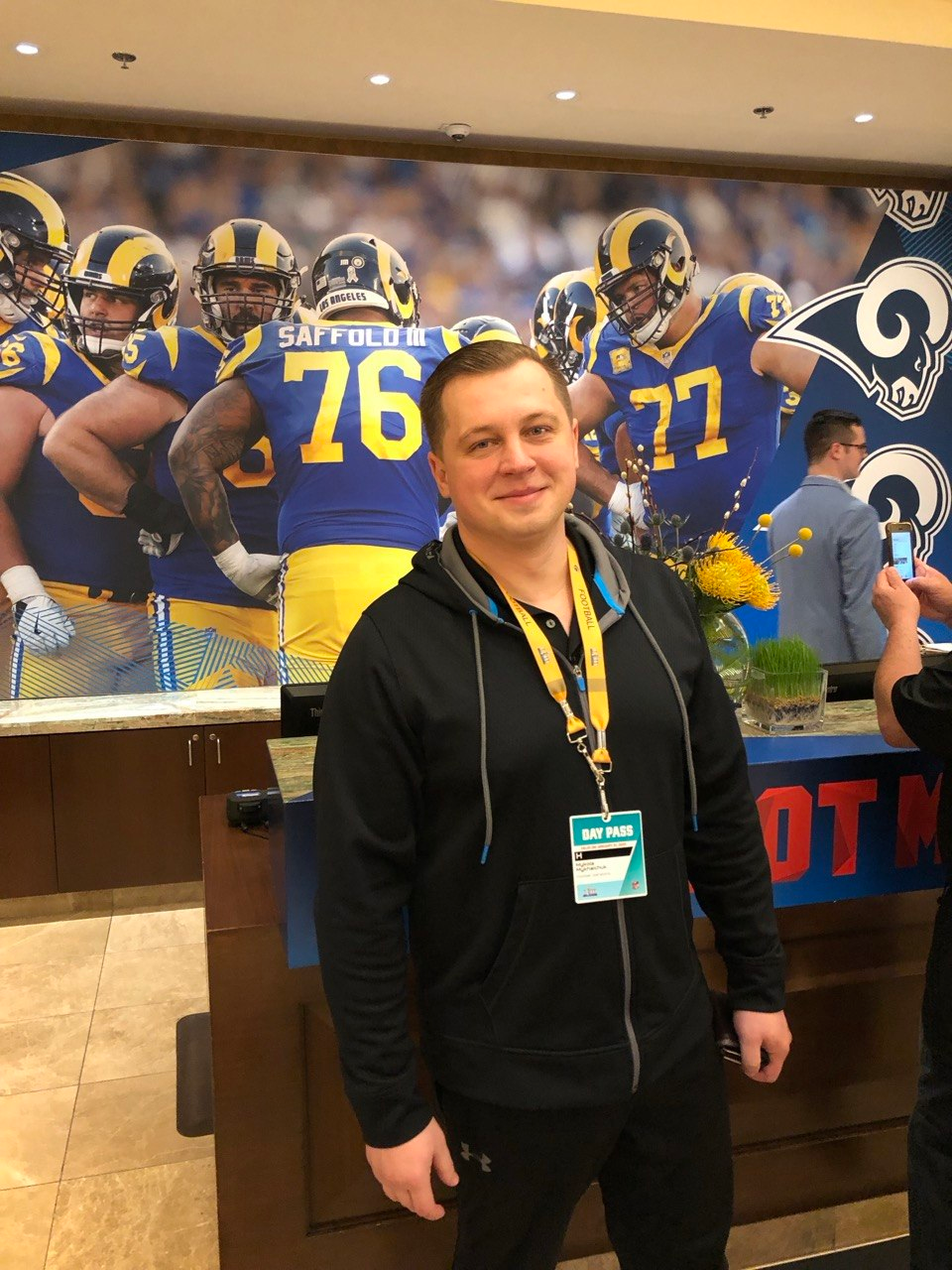 Mykola Mykhalchuk in front of a football mural